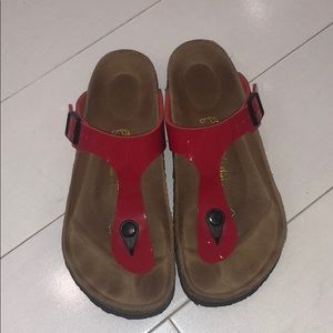 Red thong Birkenstock sandals